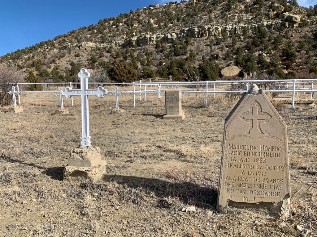 A white cross marks the burial site of Dom Santi, one of 10 Santis from Fiumalbo, Italy, who were killed in the Dawson mine explosion of Oct. 22, 1913. (Photo by Nick Pappas)