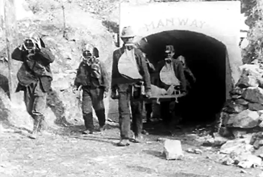 Rescuers remove the body of one of the five men killed in the Dawson mine disaster of 1920. (Photo from Dissolve video footage of recovery operation) .
