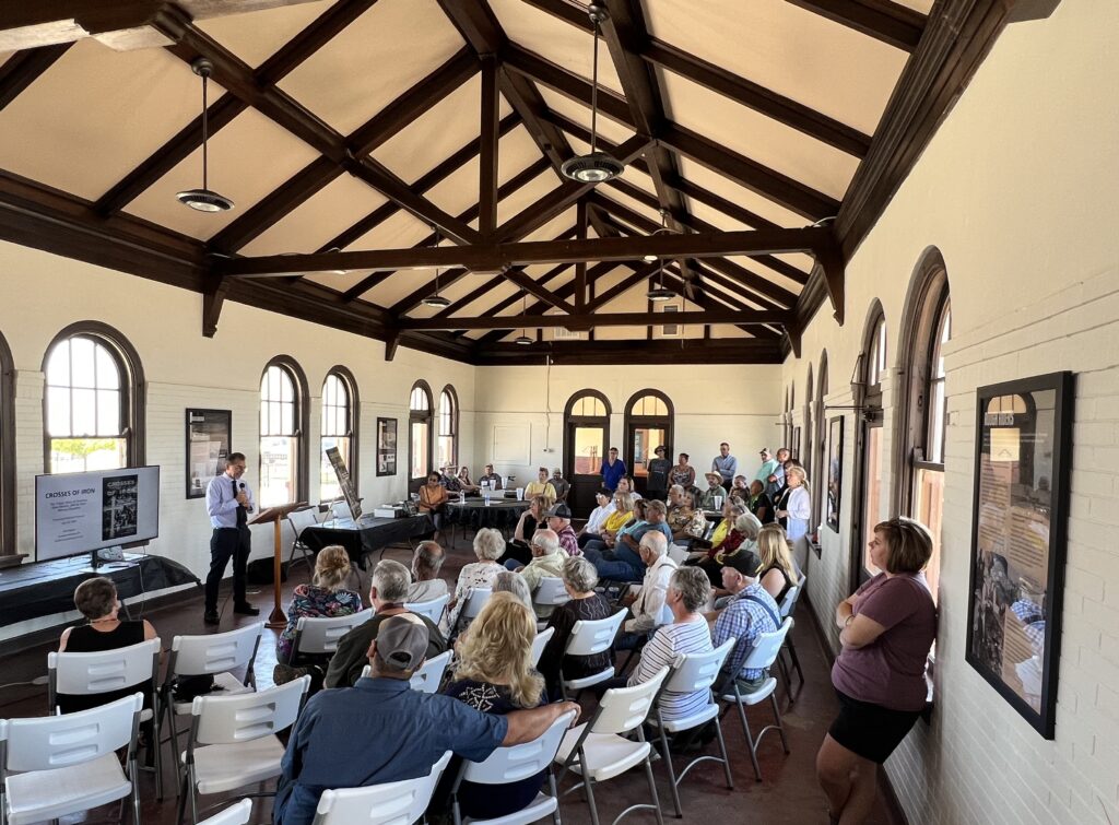 Nick Pappas speaks about the old coal town of  Dawson and his book, "Crosses of Iron: The Tragic Story of Dawson, New Mexico, and Its Twin Mining Disasters," during a July 13 visit to the Tucumcari Railroad Museum. (Photo courtesy of Jim Livingston) 